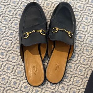 Gucci Black Leather Mules with Gold Accents